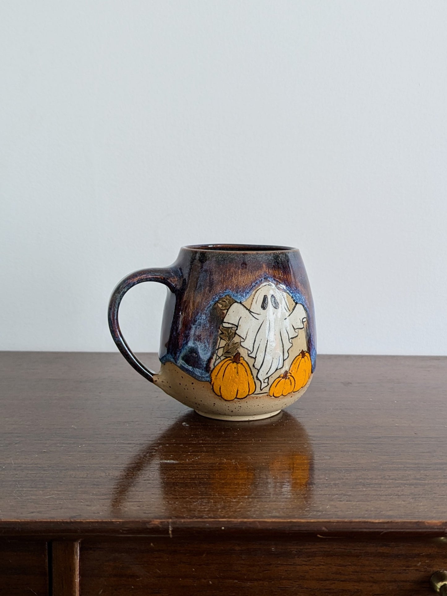Pumpkin Ghostie mug in Aurora glaze