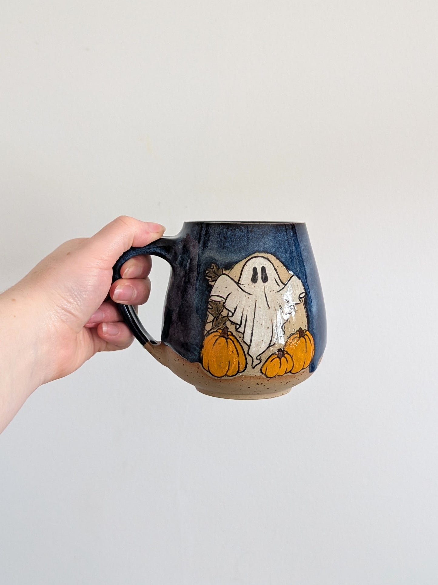 Pumpkin Ghostie mug in Midnight glaze