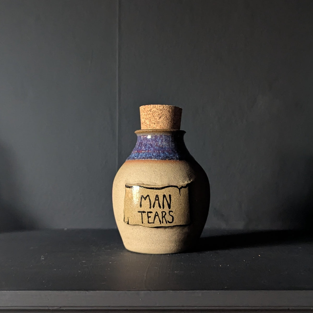 Man Tears Potion Bottle